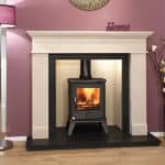 Elegant fireplace with a wood-burning stove in a modern living room setting.